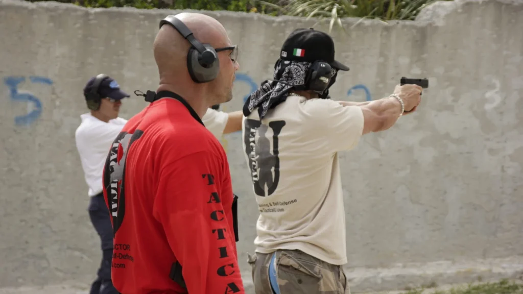 Tactical U student firing a handgun during supervised defensive firearms training.