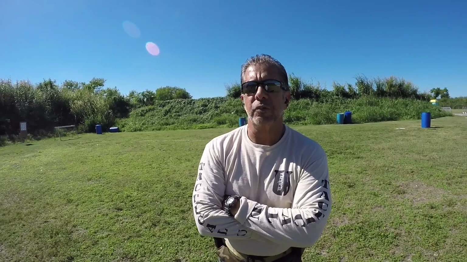 Mel Becena standing at a South Florida range during Tactical U firearms training