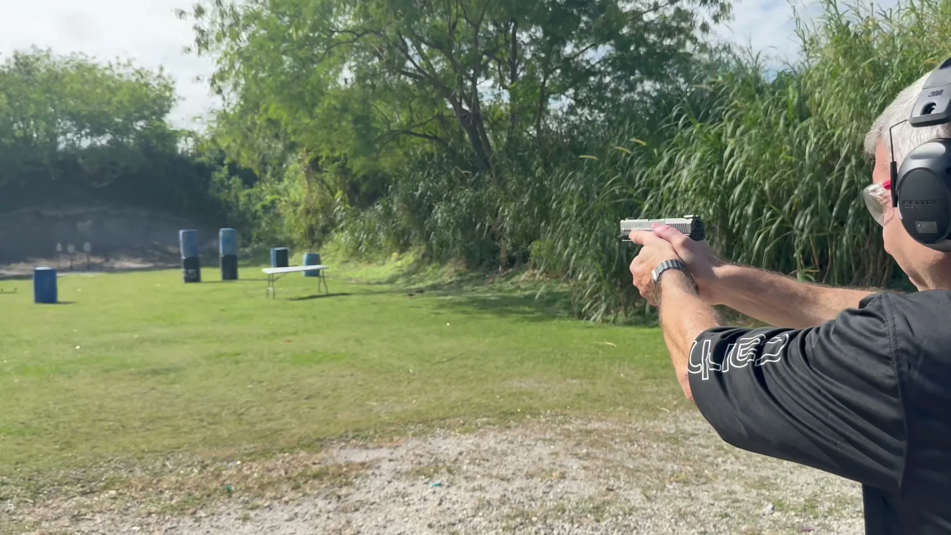 Stephen L. Cohen practicing handgun marksmanship on a South Florida range during Tactical U training