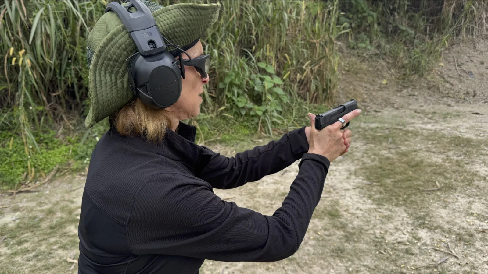 Tactical U student practicing controlled concealed draw mechanics on a South Florida range