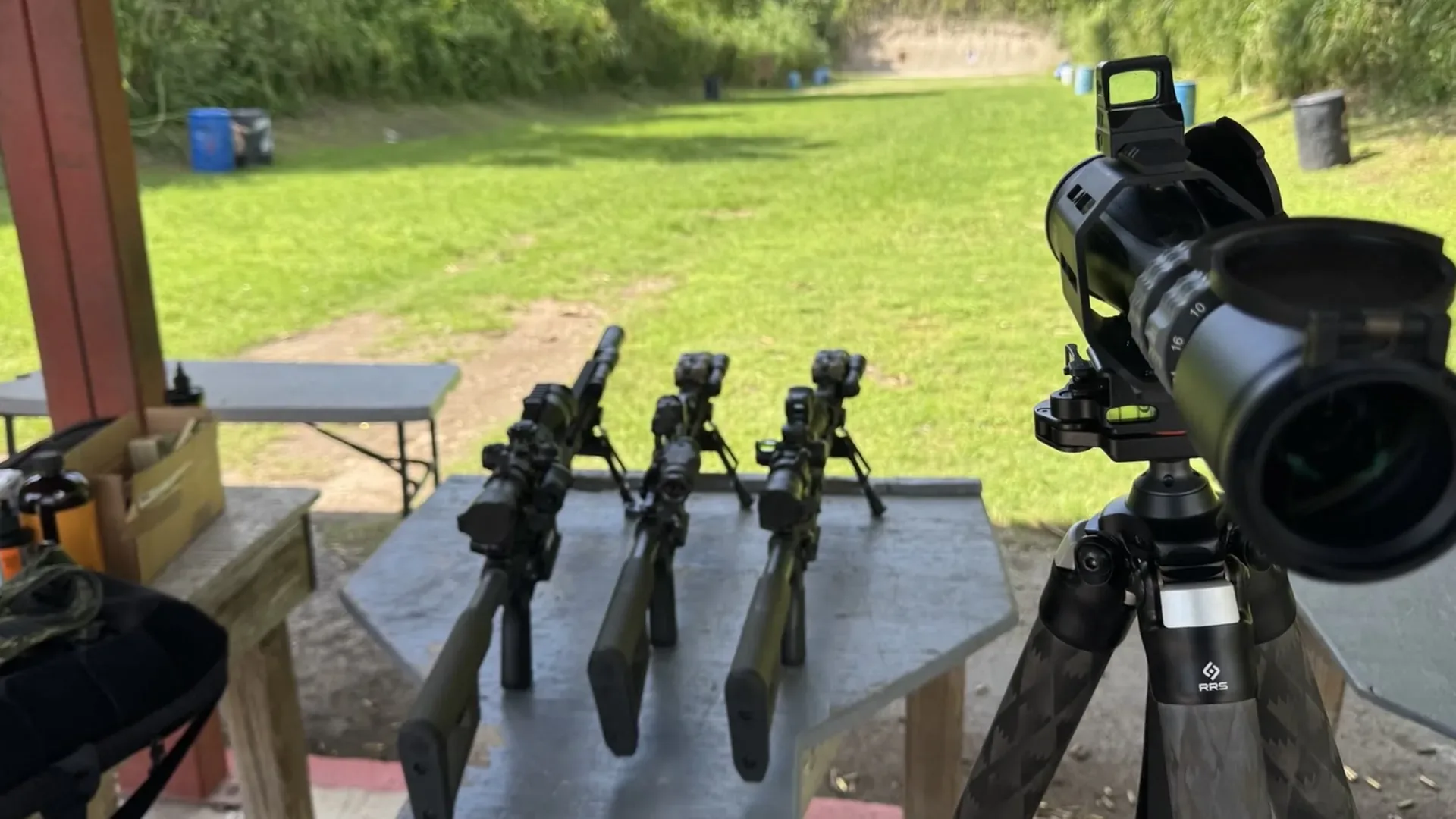 Rifles and optical equipment staged for controlled Tactical U range training