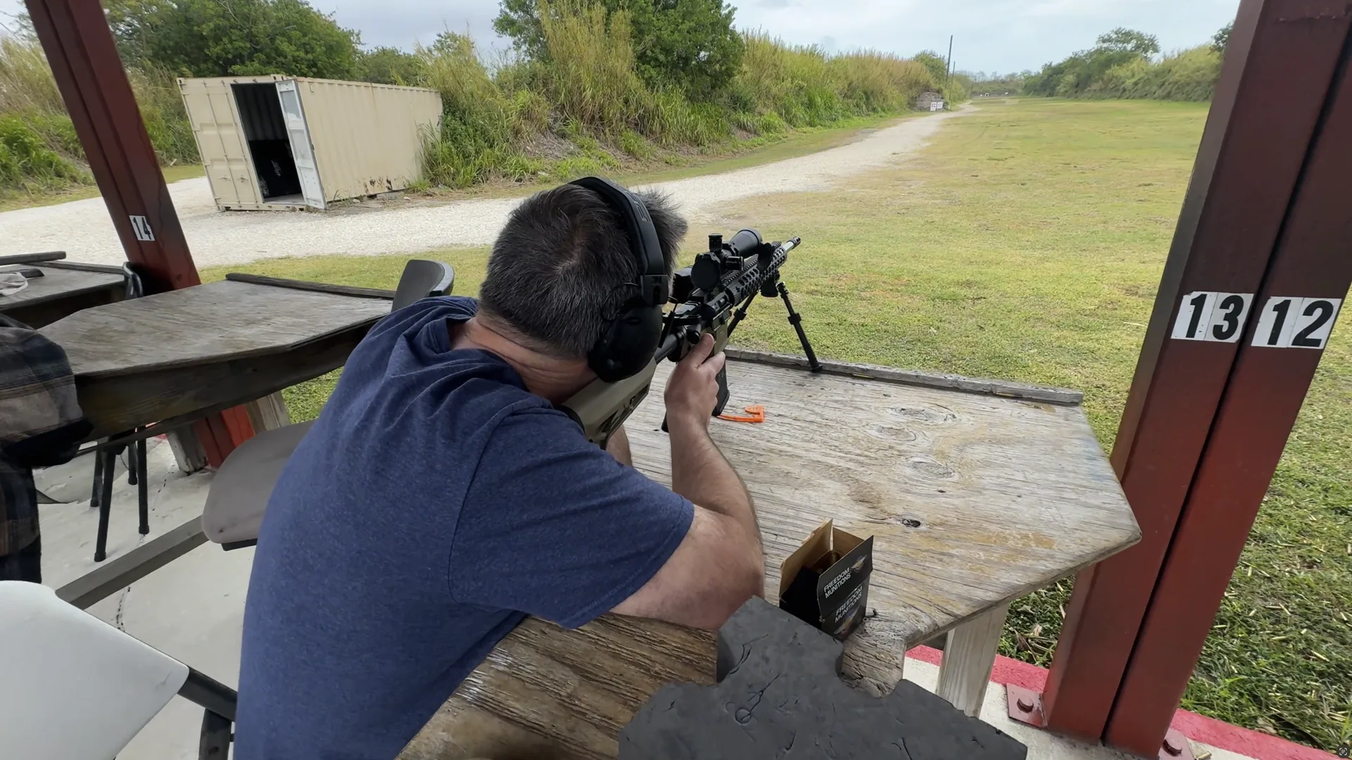 Tactical U student practicing scoped rifle marksmanship from a supported position on a South Florida range