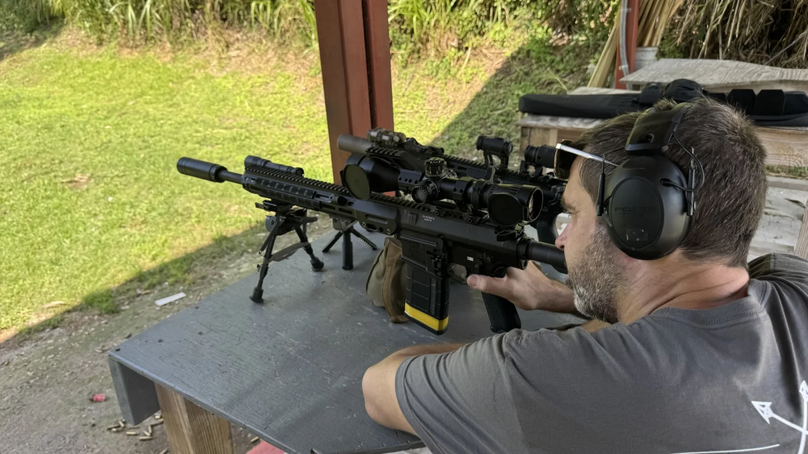 Tactical U student managing rifle and optic variables during precision training