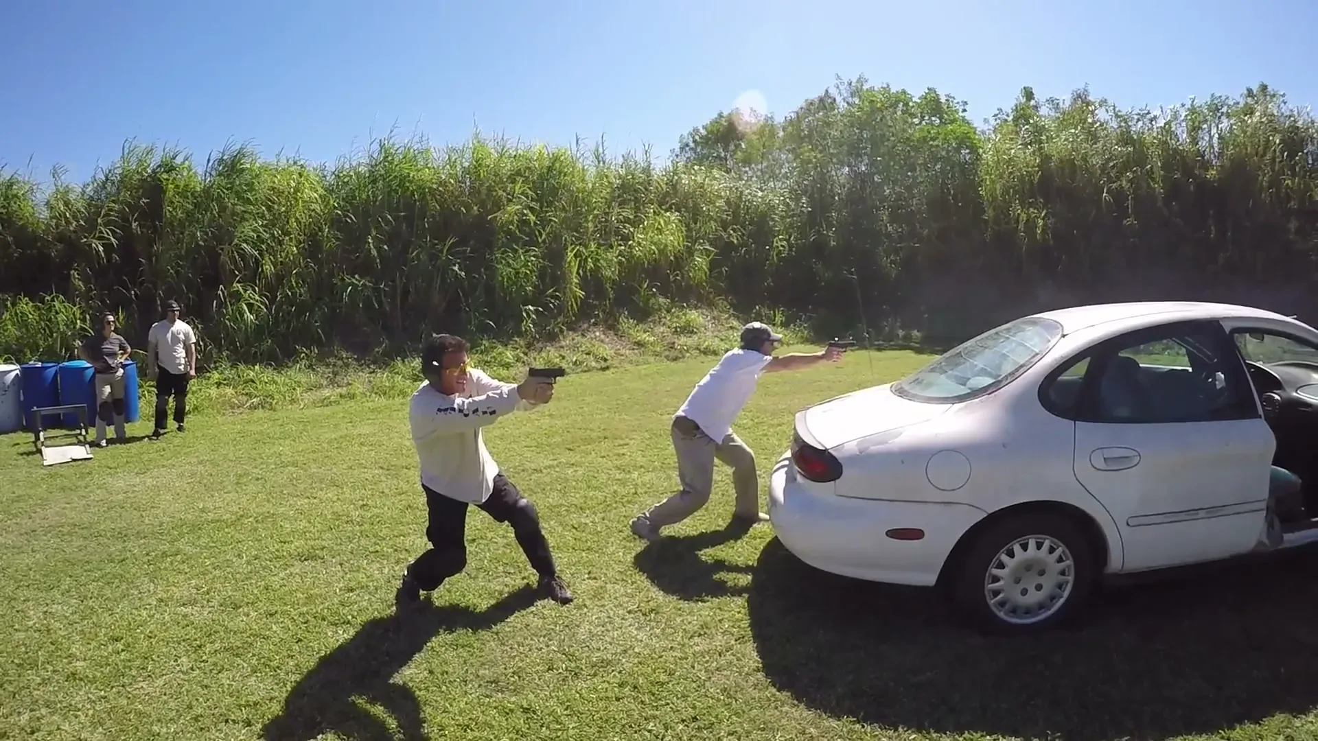 Tactical U students working together during an outdoor vehicle tactics exercise