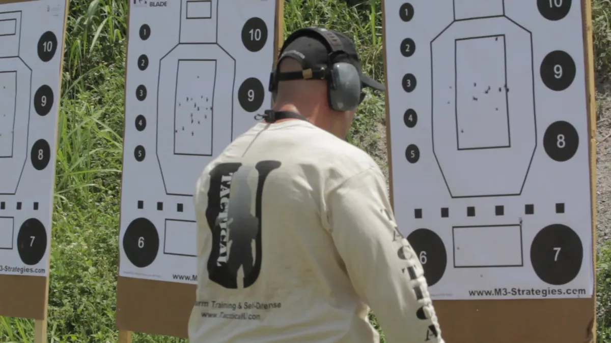 Tactical U handgun training target review after live-fire drills