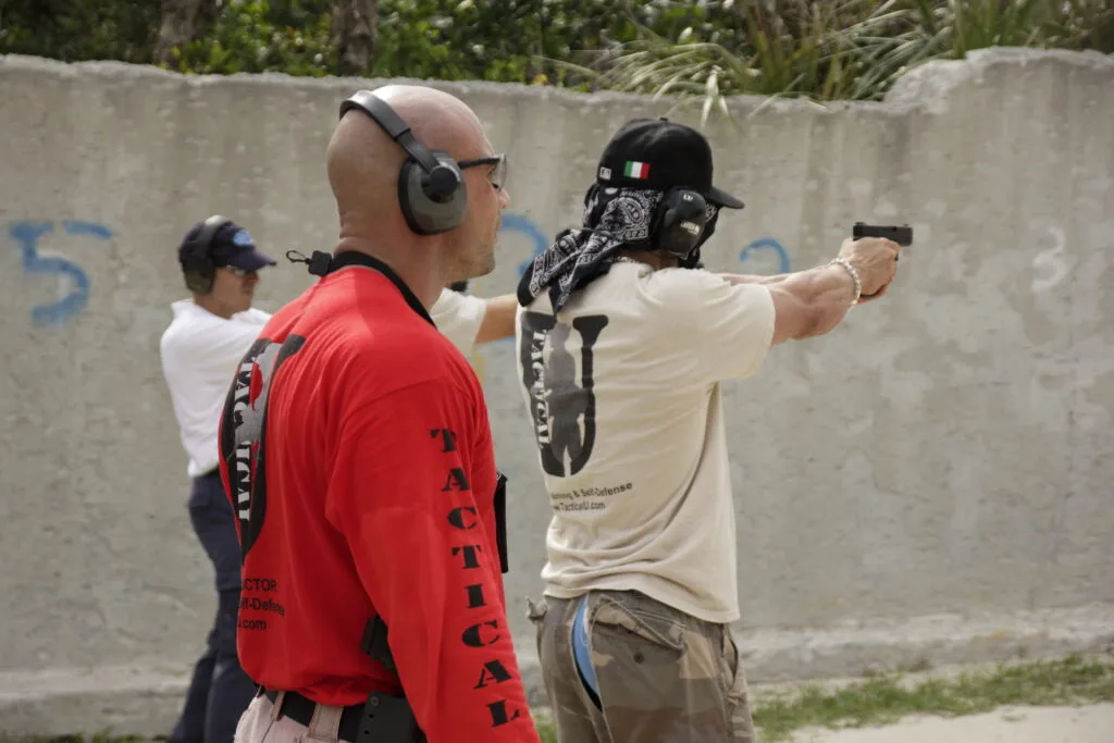 Stephen L. Cohen demonstrating controlled handgun shooting during Tactical U training