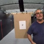Tactical U student beside his target with a tight shot group after live-fire concealed carry training in Fort Lauderdale