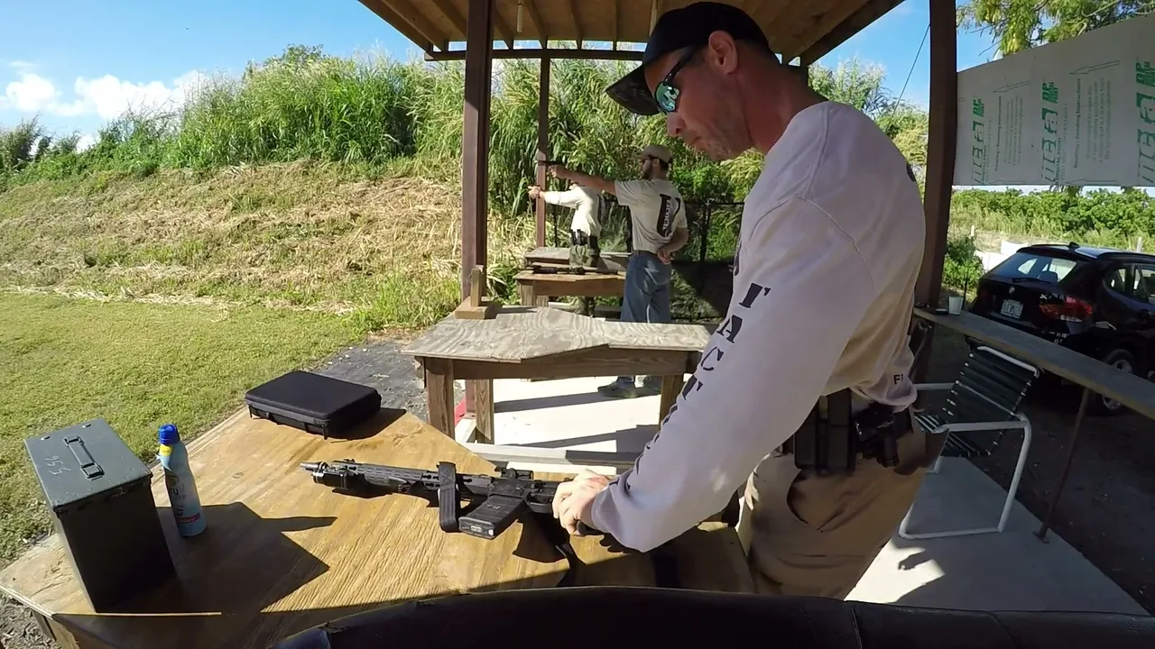 Tactical U instructor running an AR malfunction drill at the bench