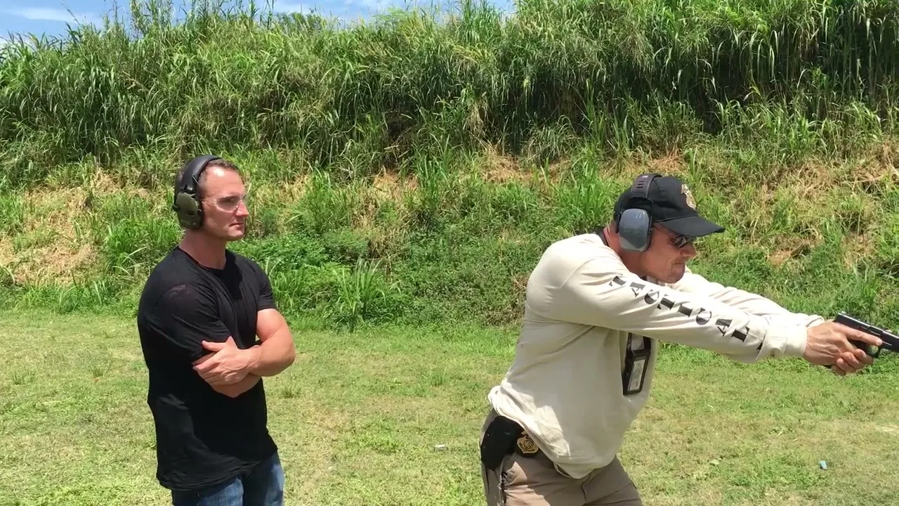 Tactical U instructor demonstrating pistol aim to one student during a private Florida CWL certification session